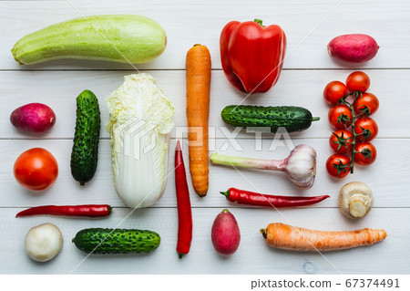 Various raw vegetables. Knolling. Zucchini, cucumber, chili pepper, mushrooms, tomato, cauliflower. 67374491
