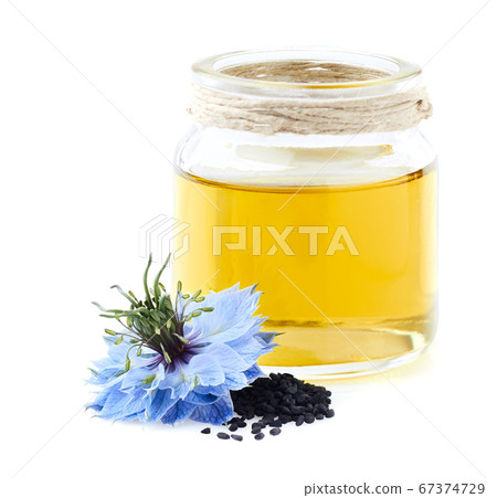 Black cumin oil on white background Black cumin oil on white background 67374729