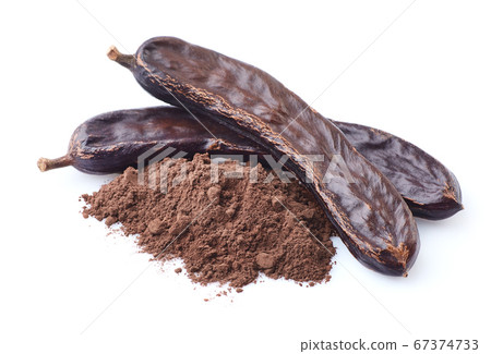 Carobs pod on white background Carobs pod on white background 67374733