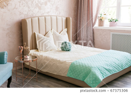 Real photo of a feminine bedroom interior with a 67375306