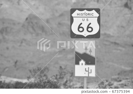 Oatman Sign, a Wild West Ghost Town in black and white. On U.S. Route 66 in the Black Mountain Range of the Sonoran Desert, Arizona USA Oatman Sign, a Wild West Ghost Town in black and white. On U.S. Route 66 in the Black Mountain Range of the Sonoran Desert, Arizona USA 67375394
