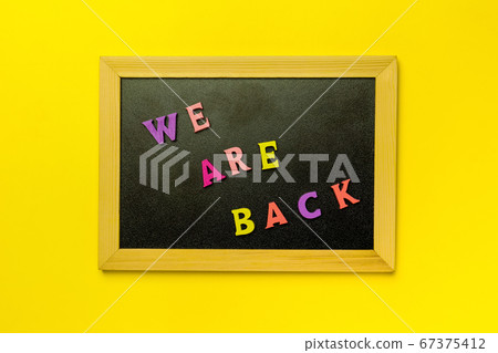 mini blackboard written Open over multi-colored 67375412