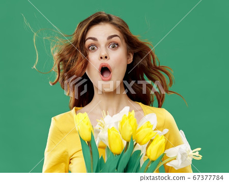 Surprised woman with a bouquet of flowers Emotion express surprise Surprised woman with a bouquet of flowers Emotion express surprise 67377784