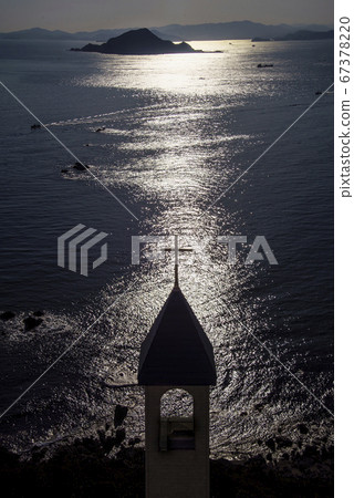 Church and Kamijima reflected in the path of light 67378220