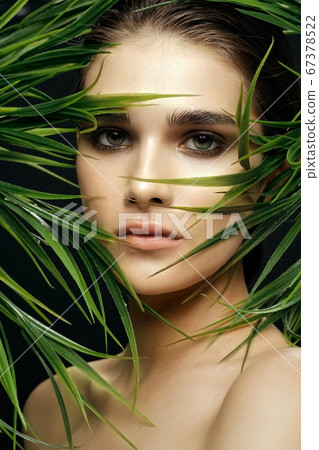Female face make-up natural look of nature green leaves health Female face make-up natural look of nature green leaves health 67378522
