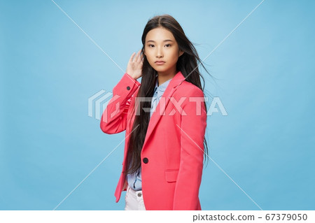 Beautiful woman in a pink jacket a classic suit Beautiful woman in a pink jacket a classic suit 67379050