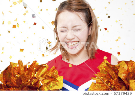 Cheerleader cheering with a smile 67379429