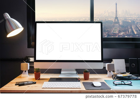 Graphic designer's workspace with cityscape view Graphic designer's workspace with cityscape view 67379778