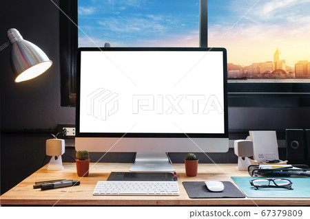 Graphic designer's workspace with cityscape view Graphic designer's workspace with cityscape view 67379809