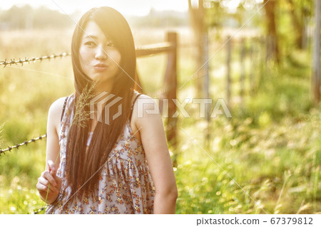 girl smiling in a meadow - happy girl girl smiling in a meadow - happy girl 67379812