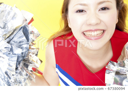 Cheerleader cheering with a smile Cheerleader cheering with a smile 67380094