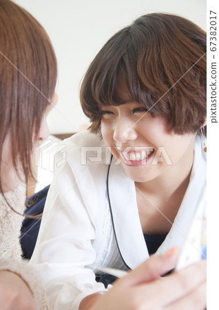 A woman talking with a smile A woman talking with a smile 67382017