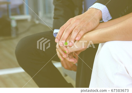 the husband encouraged his wife by holding 67383673
