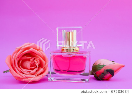 Essential oil in bottles extracted from rose 67383684