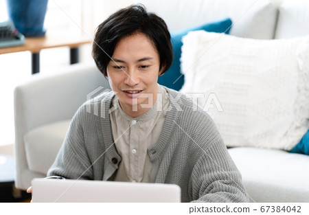 Men having an online meeting [indoor] 67384042