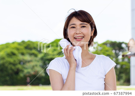 A woman sweating away A woman sweating away 67387994