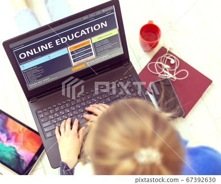 Post-secondary Learning Concept. Online Education on Portable Notebook. Post-secondary Learning Concept. Online Education on Portable Notebook. 67392630