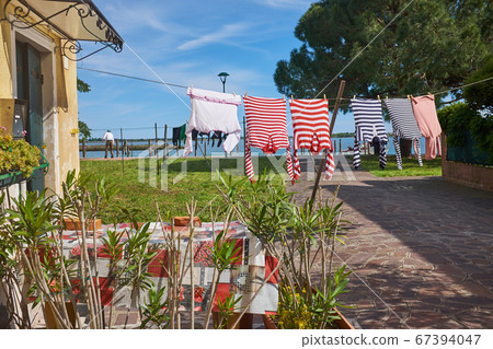 gondolier's washed clothes dry in the sun gondolier's washed clothes dry in the sun 67394047
