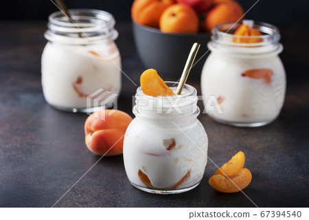 Sweet healthy yogurt with apricots Sweet healthy yogurt with apricots 67394540