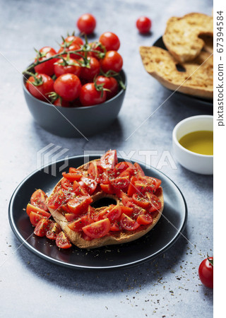 Friselle with tomato, oil and origano Friselle with tomato, oil and origano 67394584