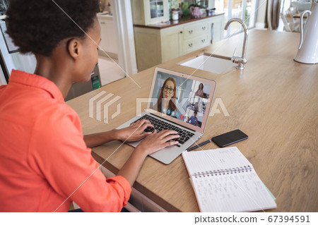Woman having a video meeting on her laptop Woman having a video meeting on her laptop 67394591