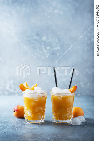Summer juice with apricots and ice Summer juice with apricots and ice 67394602