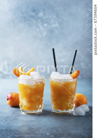 Summer juice with apricots and ice 67394604