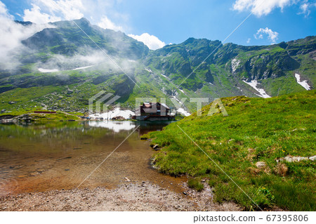 clouds above balea lake in romania. stunning 67395806