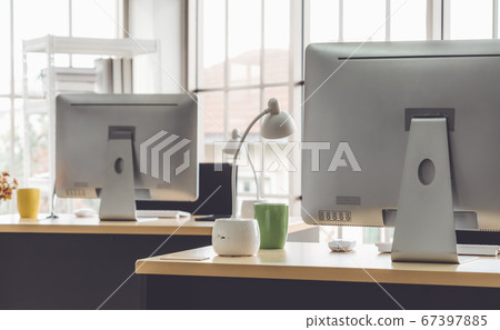 Desktop PC computers in small modern office or home office. Desktop PC computers in small modern office or home office. 67397885
