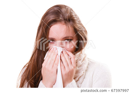 Sick woman girl with fever sneezing in tissue Sick woman girl with fever sneezing in tissue 67397997