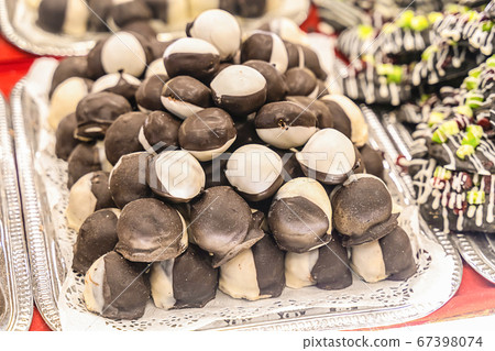 chocolate covered black and white marzipan piled chocolate covered black and white marzipan piled 67398074