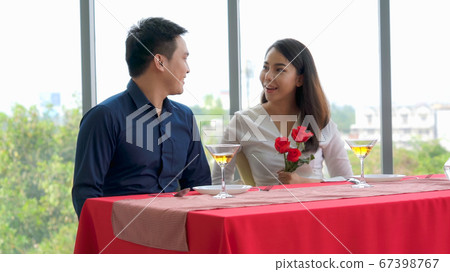 Happy romantic couple eating lunch at restaurant Happy romantic couple eating lunch at restaurant 67398767