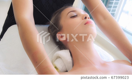 Woman gets shoulder massage spa by therapist. Woman gets shoulder massage spa by therapist. 67399023