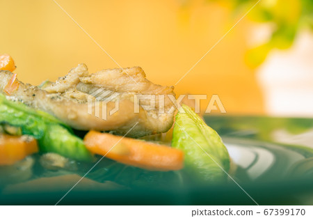 Stir Fried Noodle and Pork with Black Soy Sauce on Tree Background in Vintage Tone 67399170