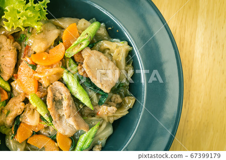 Stir Fried Noodle and Pork with Black Soy Sauce on Left Frame in Vintage Tone Stir Fried Noodle and Pork with Black Soy Sauce on Left Frame in Vintage Tone 67399179