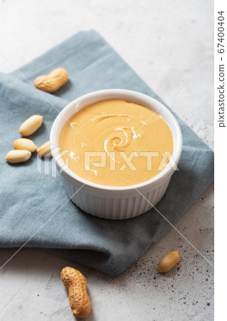 Peanut butter and nuts on the table Peanut butter and nuts on the table 67400404