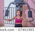 Young woman workout in gym healthy lifestyle. Young women play sports in the gym to exercise 67401965