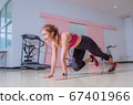 Asian woman exercising in the gym, She was pretending to "plank" 67401966