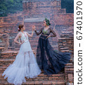 Thai Woman wearing Thai Traditional Dress in the old temple and pagoda of Thailand 67401970