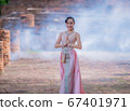 Woman wearing typical thai dress with thai style, Beauty fantasy Thai dress traditional costume on brick in old temple 67401971