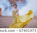 Woman wearing typical thai dress with thai style, Beauty fantasy Thai dress traditional costume on brick in old temple 67401973