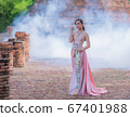 Woman wearing typical thai dress with thai style, Beauty fantasy Thai dress traditional costume on brick in old temple 67401988