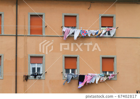clothes hanging out to dry on a washing line 67402817