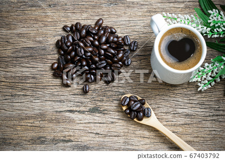 Heart coffee and coffee beans roasted in a sack on 67403792