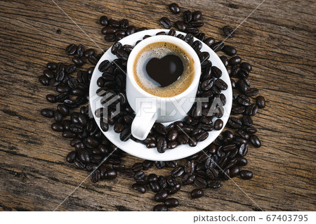 Heart coffee and coffee beans roasted in a sack on Heart coffee and coffee beans roasted in a sack on 67403795