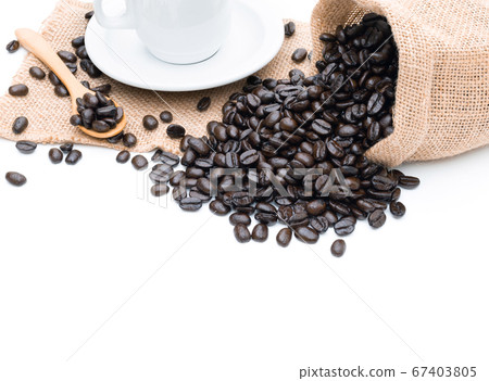 Roasted coffee beans in a sack of cloth on a white 67403805