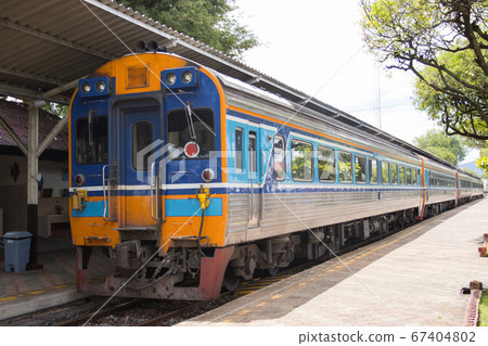 The train stops at train stations for passengers The train stops at train stations for passengers 67404802