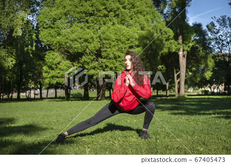 slim white young woman in leggings and red jacket slim white young woman in leggings and red jacket 67405473