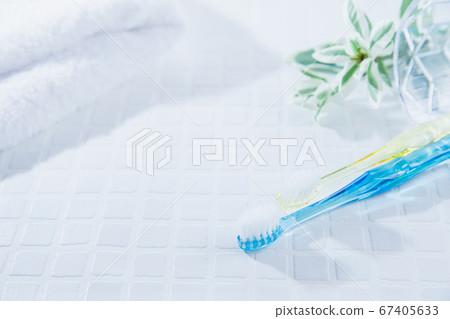 Two toothbrushes and a towel. Tooth care such as brushing teeth, image of daily life. 67405633