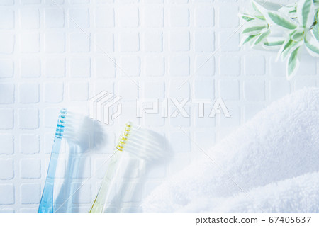 Two toothbrushes and a towel. Tooth care such as brushing teeth, image of daily life. Two toothbrushes and a towel. Tooth care such as brushing teeth, image of daily life. 67405637
